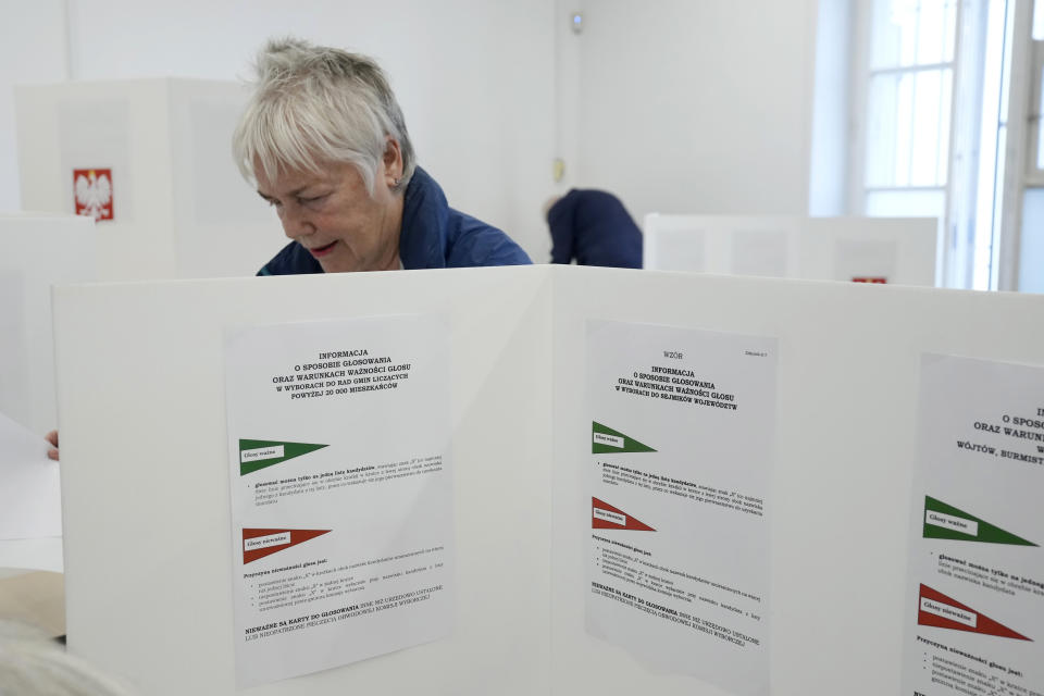 People vote during local elections in Warsaw, Poland, Sunday, April 7, 2024. Voters across Poland are casting ballots in local elections Sunday in the first electoral test for the coalition government of Prime Minister Donald Tusk nearly four months since it took power. (AP Photo/Czarek Sokolowski)