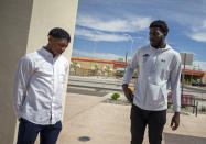 Former New Mexico State NCAA college basketball players Shak Odunewu, right, and Deuce Benjamin chat after a news conference in Las Cruces, N.M., Wednesday, May 3, 2023. Odunewu and Benjamin discussed the lawsuit they filed alleging teammates ganged up and sexually assaulted them multiple times, while their coaches and others at the school didn't act when confronted with the allegations. (AP Photo/Andres Leighton)