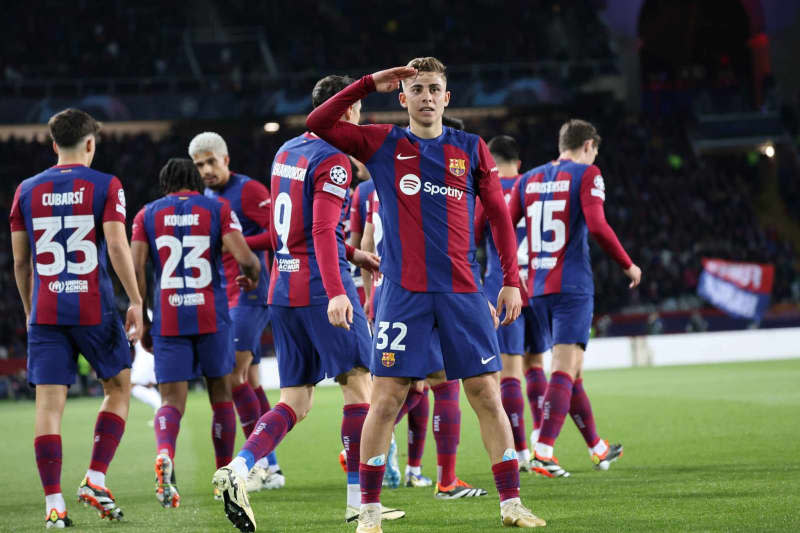 Barcelona's Fermin Lopez (C) cerebrates scoring his side's first goal of the game during the UEFA Champions League Round of 16, second leg soccer match between Barcelona and Napoli at the Estadio Olimpic Lluis Companys. Fabio Sasso/ZUMA Press Wire/dpa