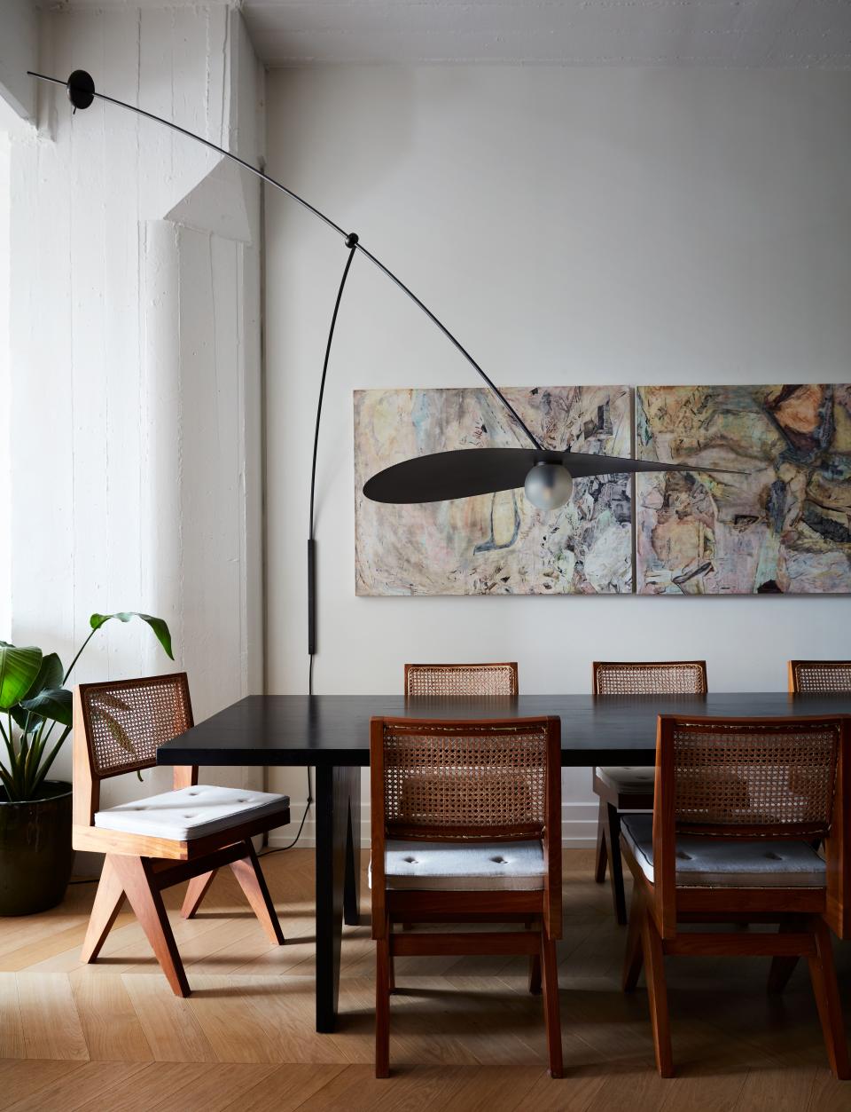 Valle designed the maple dining table and, with Ladies & Gentlemen Studio, the wall-mounted mobile lamp. The painting is by Christopher Astley.