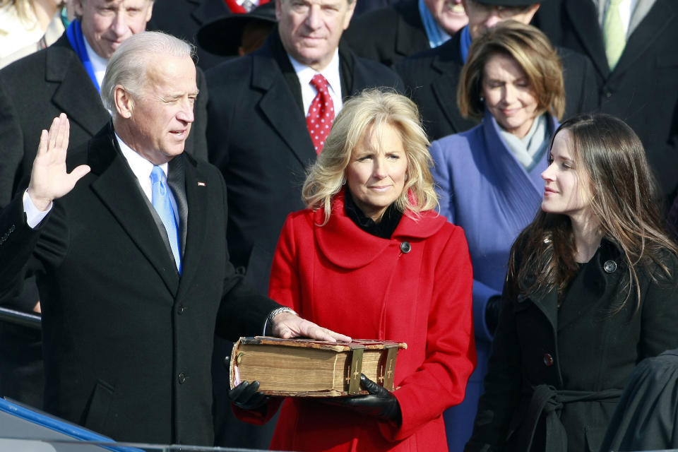 Biden is sworn in by Supreme Court Justice John Paul Stevens during the inauguration of Obama as the 44th president on Jan. 20, 2009.