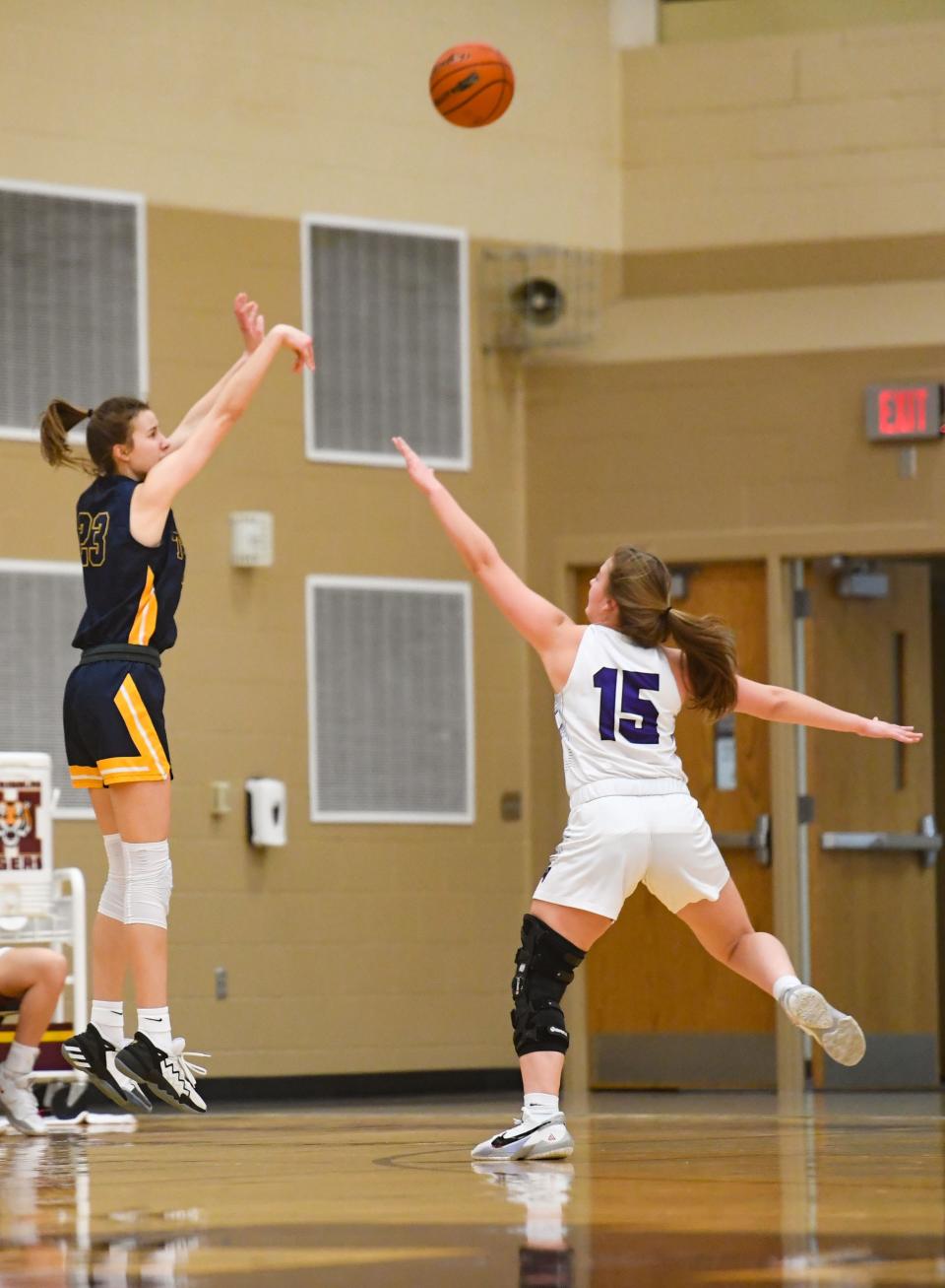 Tea Area's Katie Vasecka shoots a three-pointer before Dakota Valley's Brooke Carlson can stop her during a class A state qualifying game on Thursday, March 4, 2021, at Harrisburg High School.