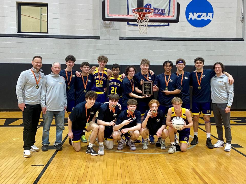 The Rhinebeck boys basketball team poses on the court at Bard College after winning the Section 9 Class C championship on March 5, 2023.