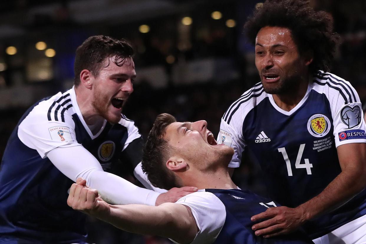 Martin celebrates his late winner for Scotland: Getty Images