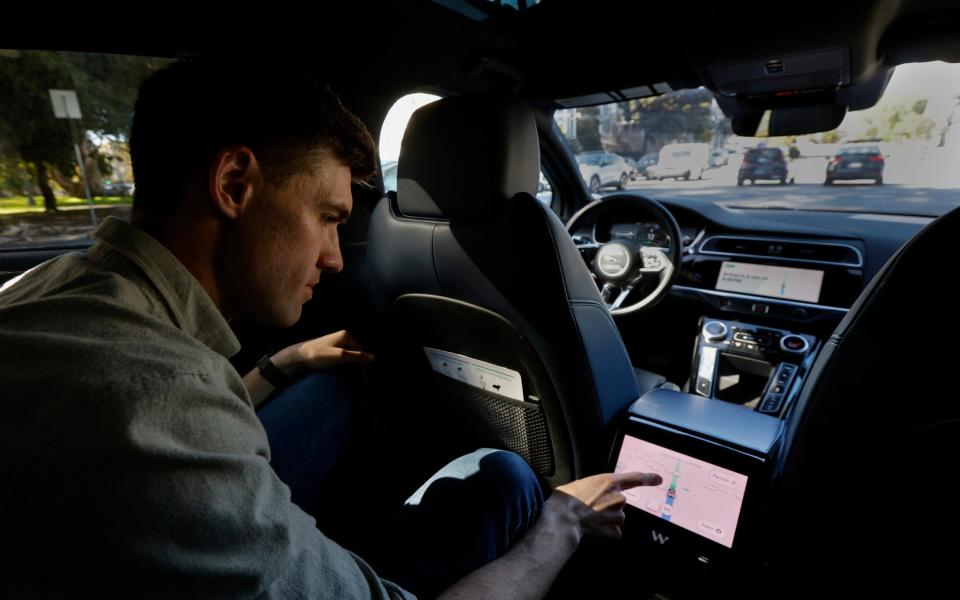The Telegraph's James Titcomb sits in the back of a driverless car