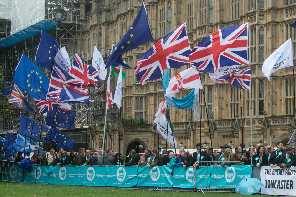 LONDON, UNITED KINGDOM - 2019/10/14: Pro Remain and Brexit supporters holding banners and flags demonstrate outside Parliament after The Queen's Speech on the State Opening of Parliament when the Government unveils its new legislative programme. (Photo by Amer Ghazzal/SOPA Images/LightRocket via Getty Images)