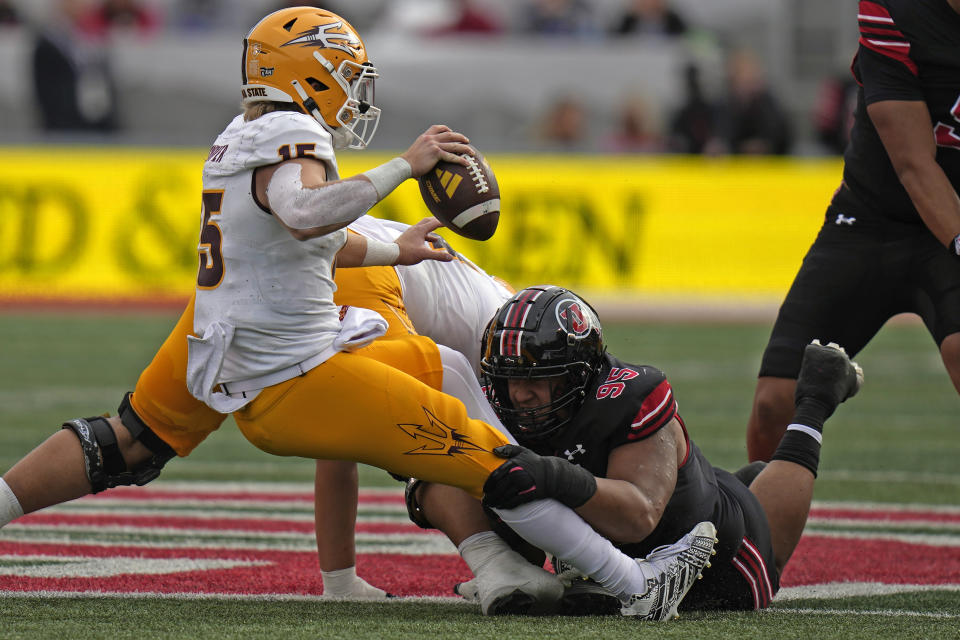 Utah defensive tackle Aliki Vimahi (95) sacks Arizona State quarterback Jacob Conover (15) during the second half of an NCAA college football game Saturday, Nov. 4, 2023, in Salt Lake City. (AP Photo/Rick Bowmer)