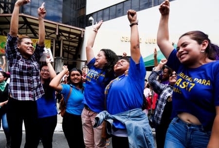 People react as Evelyn Hernandez, who was sentenced to 30 years in prison for a suspected abortion, leaves after being absolved at a hearing in Ciudad Delgado