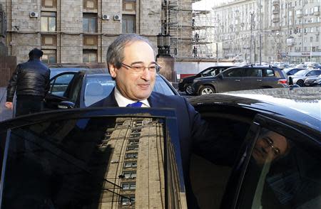 Syria's Deputy Foreign Minister Faisal Mekdad gets into a car after leaving the headquarters of the Russian foreign ministry in Moscow, November 18, 2013. A Syrian government delegation met Russian officials on Monday to discuss plans for an international peace conference on the conflict in the Middle East nation. REUTERS/Grigory Dukor