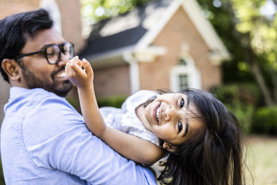 A man holding his daughter