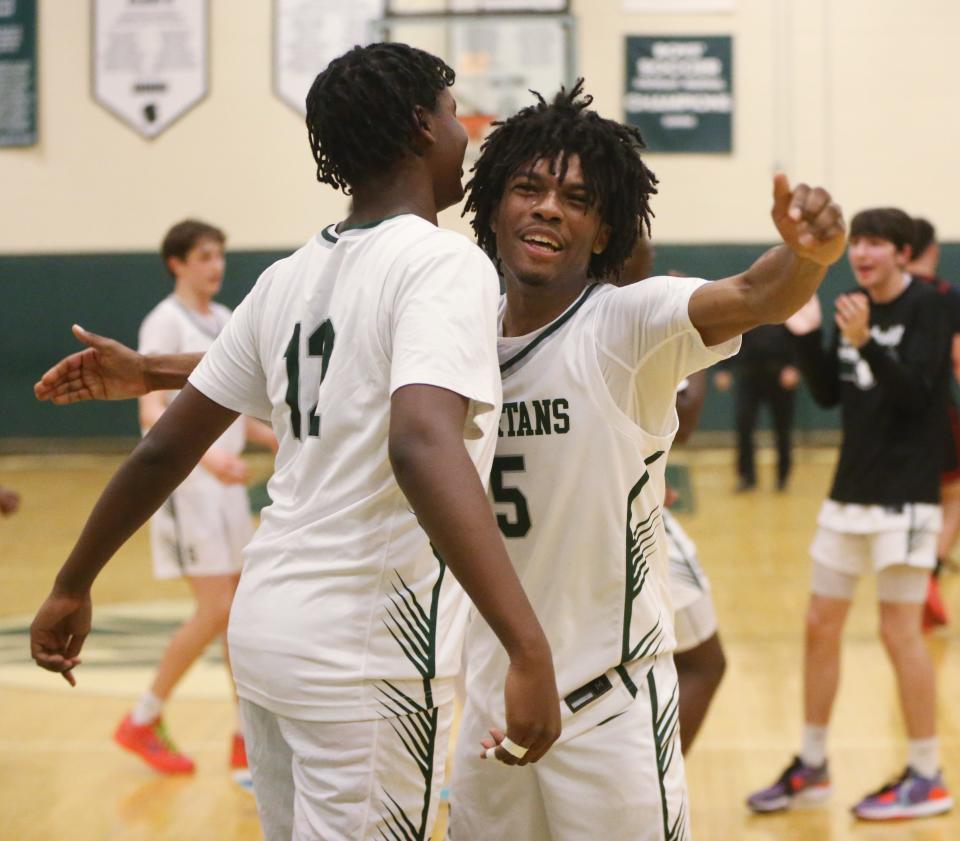 Spackenkill's, from left, Jalin Thompson and Nasir Snell celebrate winning the Section 9 Class A boys basketball quarter final over Port Jervis on February 26 2024.