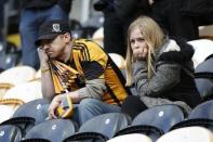 Hull City fans look dejected after being relegated from the Barclays Premier League. Action Images via Reuters / Craig Brough