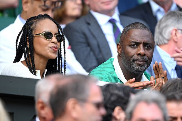 <p>Karwai Tang/WireImage</p> Sabrina Dhowre and Idris Elba at Wimbledon