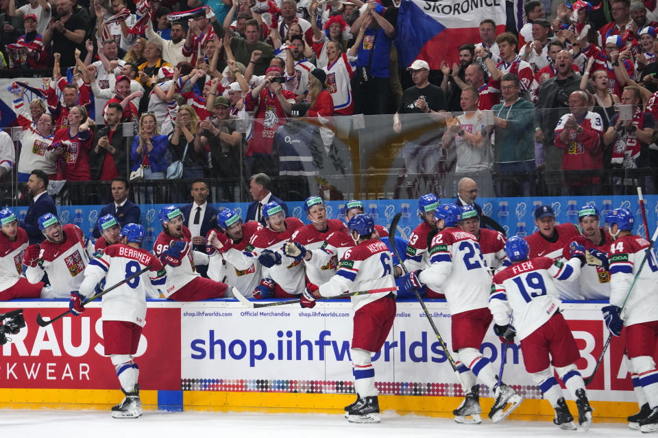 Czech Republic's Ondrej Beranek , left,celebrates with teammates after scoring his sides third goal during the preliminary round match between Czech Republic and Norway at the Ice Hockey World Championships in Prague, Czech Republic, Saturday, May 11, 2024. (AP Photo/Petr David Josek)