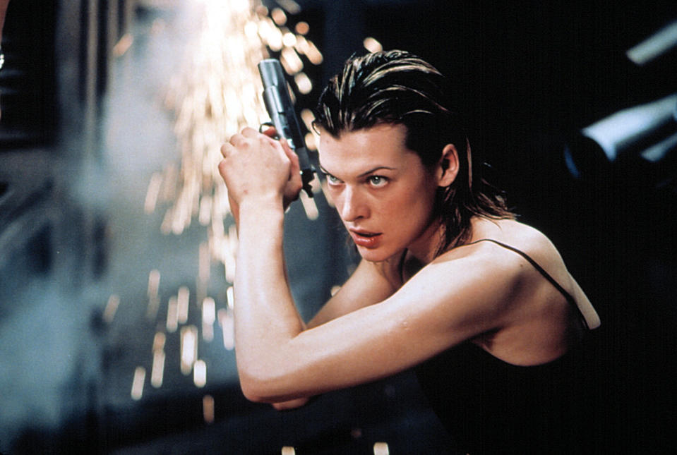 Milla Jovovich holds a gun