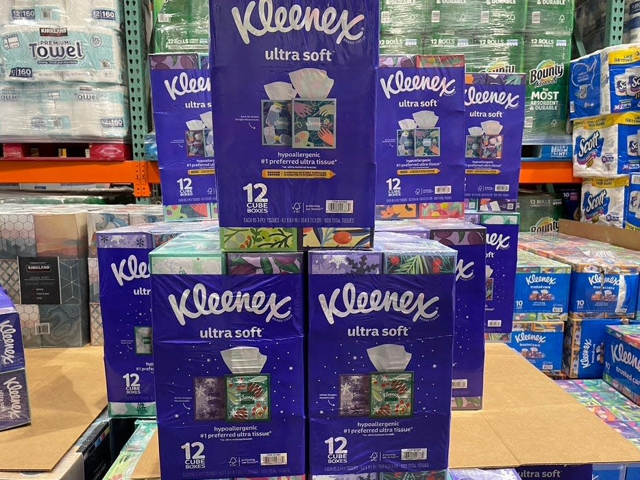 A stack of Kleenex Ultra Soft Tissues in purple wrapping.