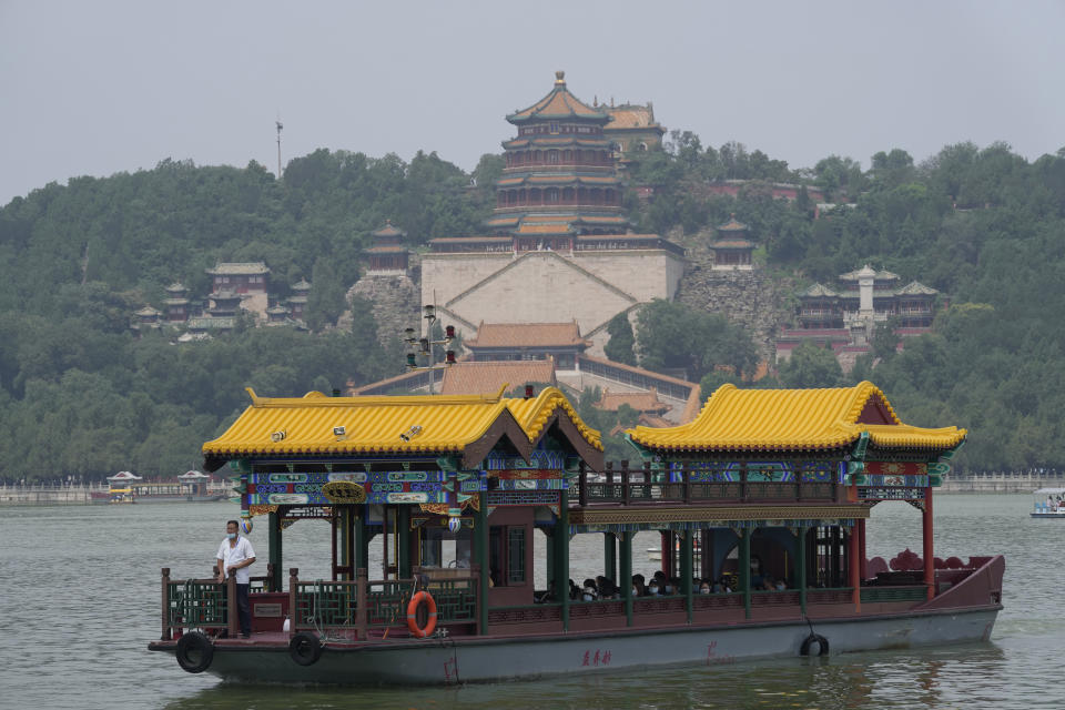 A ferry transports tourists visiting the Summer Palace in Beijing on Aug. 3, 2021. Strict virus control measures have allowed China to return to relatively normal life. The number of tourists visiting Beijing in June and July tripled compared to the same period last year, while revenue quadrupled, according to Trip.com, China's largest online travel booking platform. (AP Photo/Ng Han Guan)