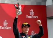 Britain Formula One - F1 - British Grand Prix 2016 - Silverstone, England - 10/7/16 Reb Bull's Max Verstappen celebrates with the trophy after finishing third REUTERS/Andrew Boyers Livepic EDITORIAL USE ONLY.