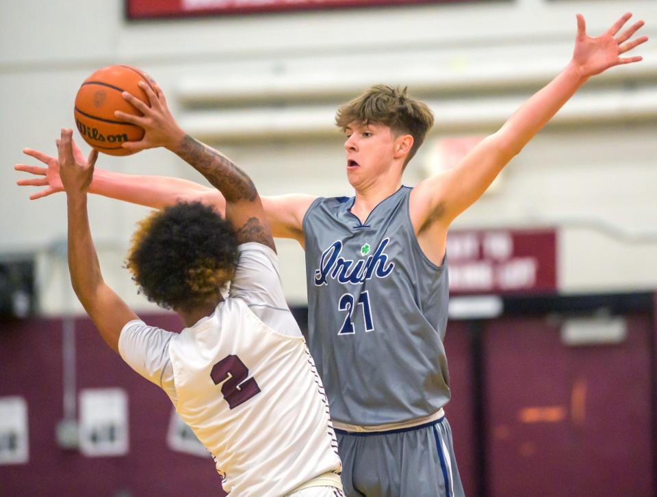 Peoria Notre Dame's Eoin Dillon defends against Peoria High's De'Kwon Brown in the first half Tuesday, Dec. 13, 2022 at Peoria High.