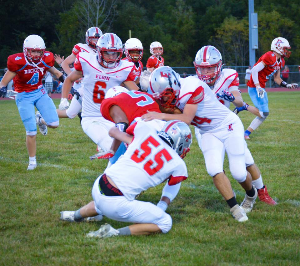 Elgin's defense stops a play at Ridgedale last year in a Northwest Central Conference football game.