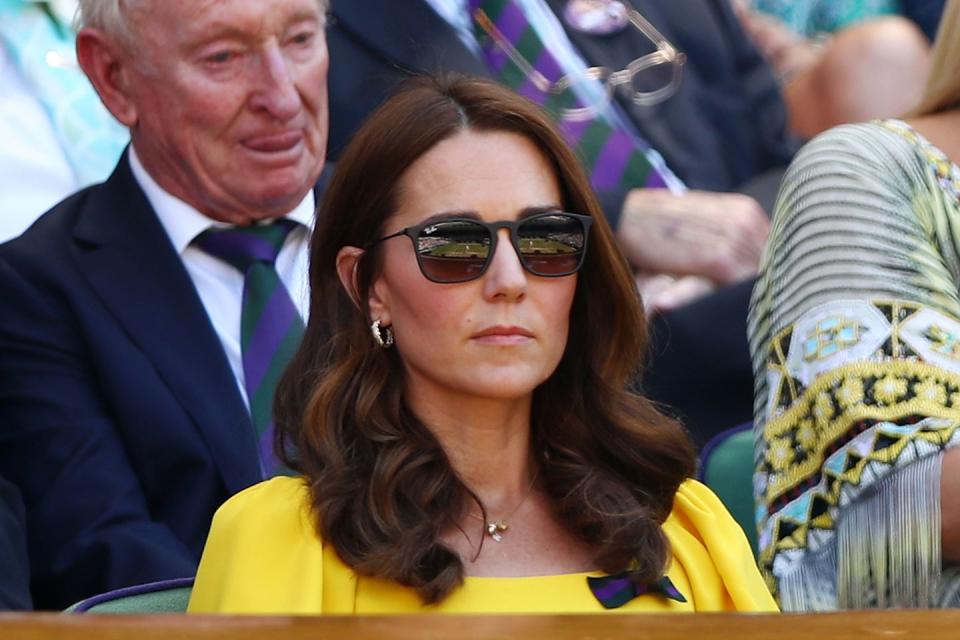 <p>Kate wore a gold charm necklace and gold hoops to Wimbledon in July 2018. </p>