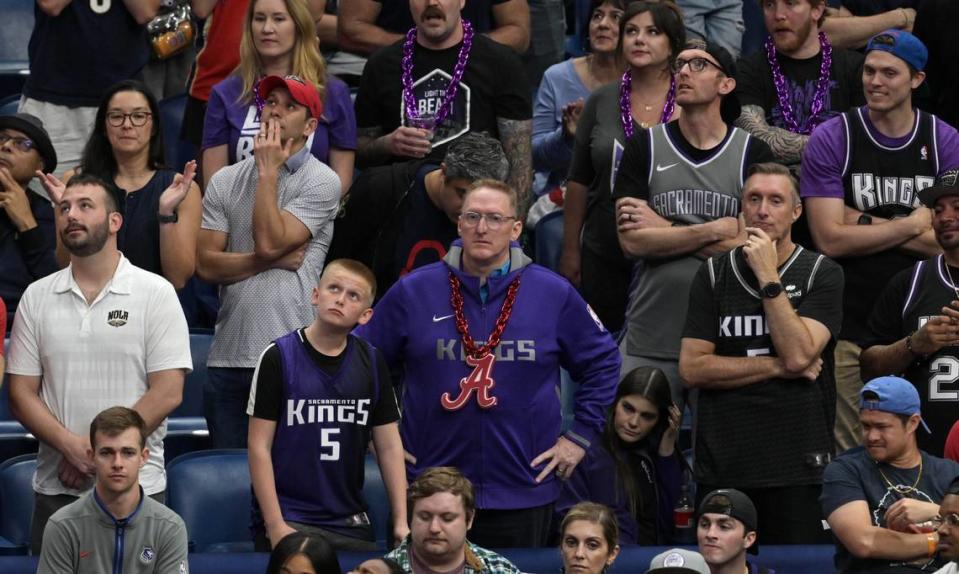 Dejected Sacramento Kings fans watch their team trail the New Orleans Pelicans in the second half of an NBA play-in game at Smoothie King Center in New Orleans on Friday, April 19, 2024.