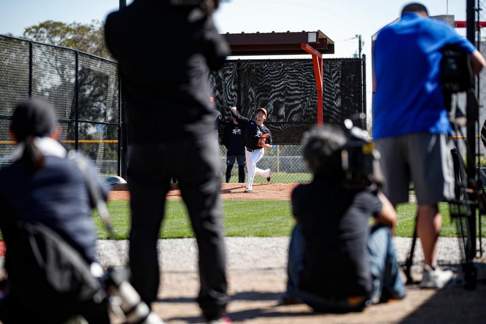 Media members record as pitcher Kenta Maeda throws before live batting during spring training at TigerTown in Lakeland, Fla. on Wednesday, Feb. 21, 2024.
