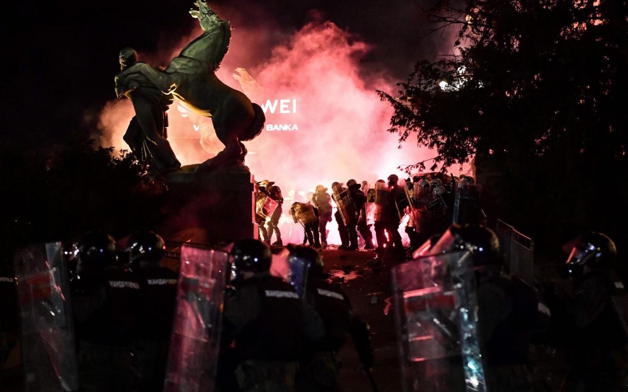 Police and protesters clash at Serbia's parliament on Friday as the Balkans face up to a renewed surge in coronavirus -  ANDREJ ISAKOVIC/AFP