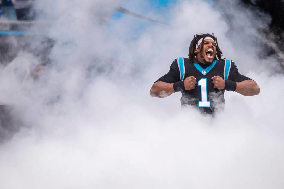 Panthers quarterback Cam Newton does his signature Superman pose during introductions before the game against the Washington Football Team at Bank of America Stadium on Sunday, November 21, 2021 in Charlotte, NC.