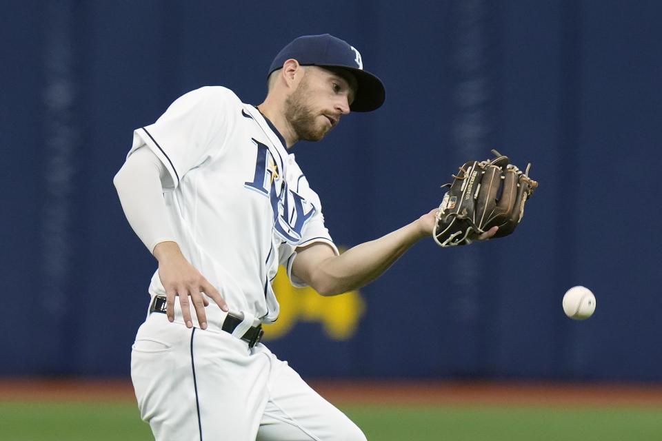 Tampa Bay Rays second baseman Brandon Lowe misplays a pop up by Seattle Mariners' Julio Rodriguez but is able to force Mariners' J.P. Crawford at second base during the ninth inning of a baseball game Thursday, April 28, 2022, in St. Petersburg, Fla. (AP Photo/Chris O'Meara)