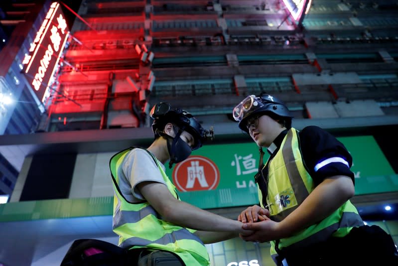 The Wider Image: Sermons with saline: Hong Kong pastor offers aid and prayers