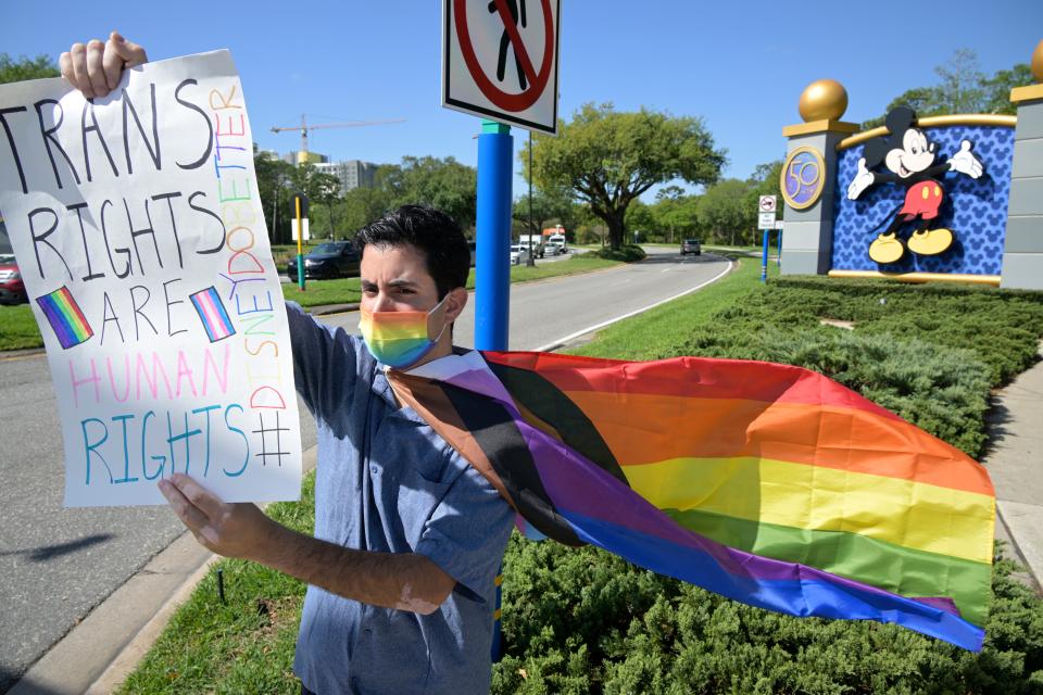 Nicholas Maldonado protested near one of Walt Disney World's entrances Tuesday.