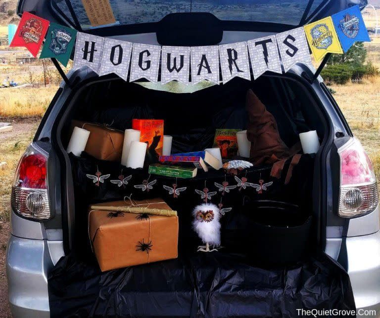 <p>Somewhere around Platform 9 3/4 you'll be able to find this trunk, a magical re-creation of the Great Hall at Hogwarts, complete with house banners, floating candles and snowy owls. Just don't be careful with those any-flavor jellybeans.</p><p><a href="https://thequietgrove.com/diy-hogwarts-themed-trunk-or-treat/" rel="nofollow noopener" target="_blank" data-ylk="slk:See more at The Quiet Grove »" class="link "><em>See more at The Quiet Grove »</em></a></p>