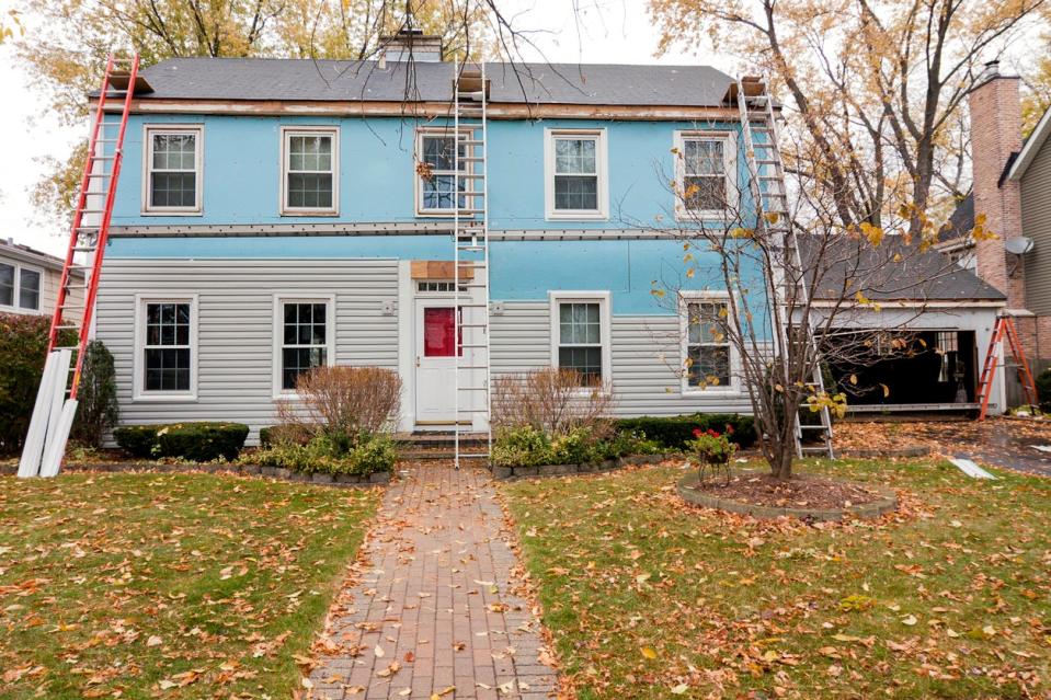 Renovating old, blue colonial home. 