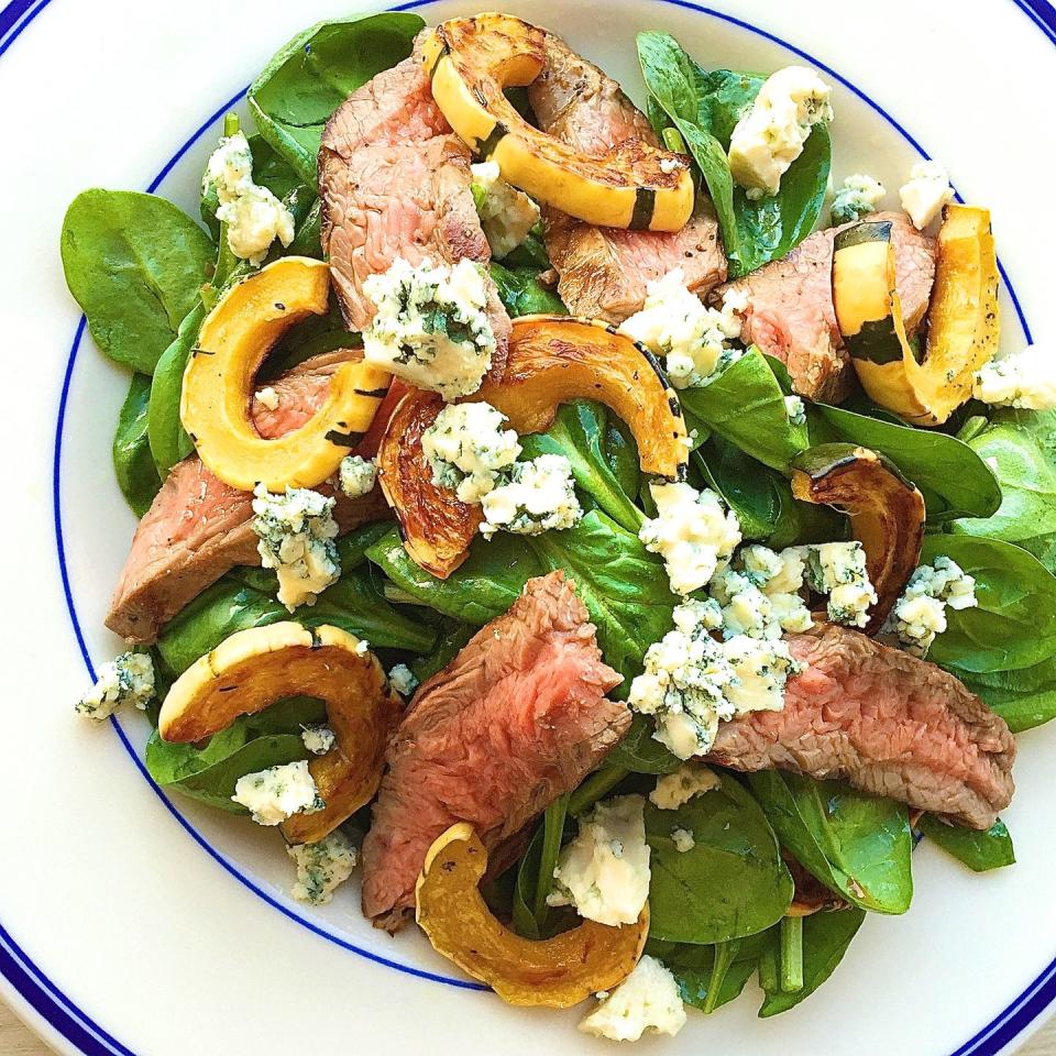 <p>Beef up your salad—literally.</p><p>Get the recipe from <a href="https://www.delish.com/cooking/recipe-ideas/recipes/a44068/steak-salad-spinach-delicata-squash-blue-cheese-recipe/" rel="nofollow noopener" target="_blank" data-ylk="slk:Delish;elm:context_link;itc:0;sec:content-canvas" class="link ">Delish</a>.</p>