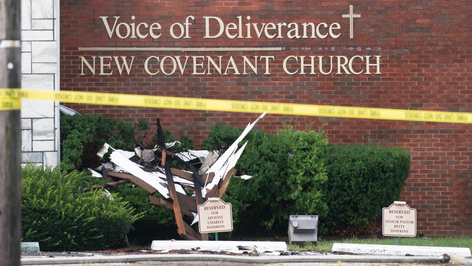 Debris lays in front of the Voice of Deliverance New Covenant Church in Vineland, after a blaze ripped through the church on Monday night, as crews work at the fire scene on Tuesday, August 8, 2023.  