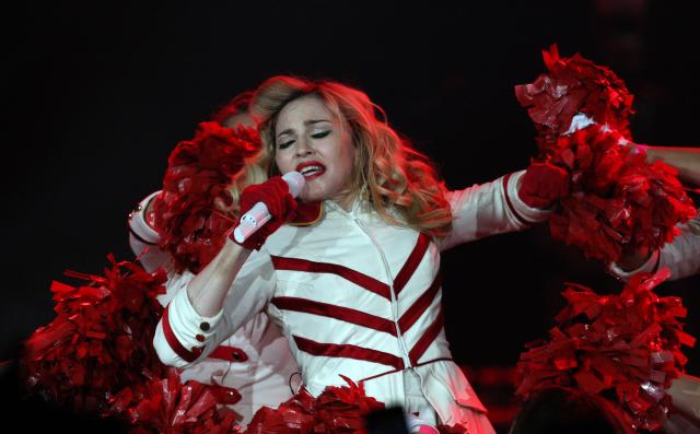 FILE - U.S. singer Madonna performs during her concert at concert Hall in St. Petersburg, Russia, in this Thursday, Aug. 9, 2012 file photo. A Russian court has dismissed a lawsuit that sought millions of dollars in damages from Madonna for allegedly traumatizing minors by speaking up for gay rights during a concert in St. Petersburg. (AP Photo/ Olga Maltseva, File)
