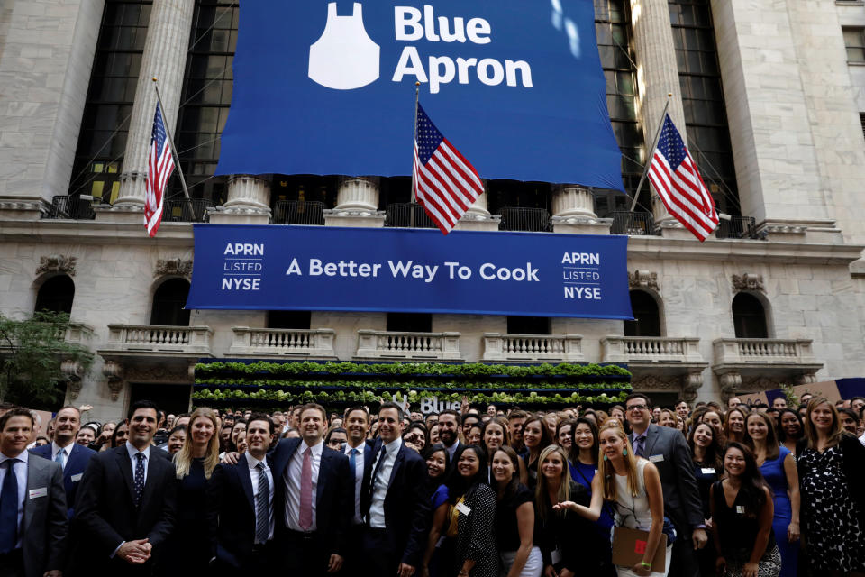 Blue Apron CEO Matthew B. Salzberg (C) poses with employees in front of the New York Stock Exchange before the company's IPO in New York, U.S., June 29, 2017.  REUTERS/Lucas Jackson