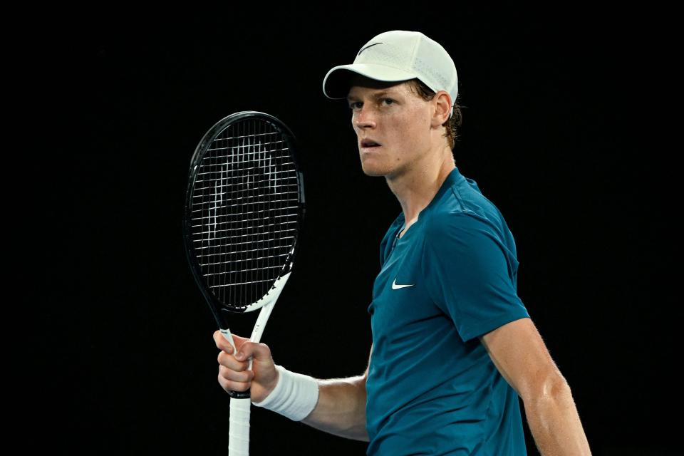 Sinner reacts after clinching the third set (AFP via Getty Images)