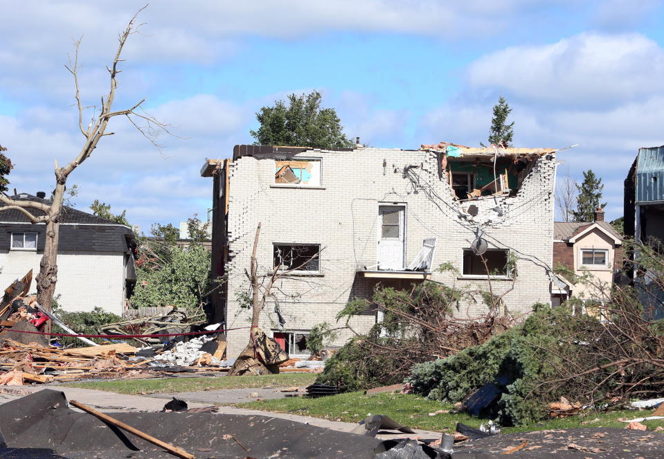 <p>A damaged apartment building is shown in a Gatineau, Que. neighbourhood on Saturday, September 22, 2018. A tornado on Friday afternoon tore roofs off of homes, overturned cars and felled power lines in the Ottawa community of Dunrobin and in Gatineau, Que. (Photo from Fred Chartrand/The Canadian Press) </p>