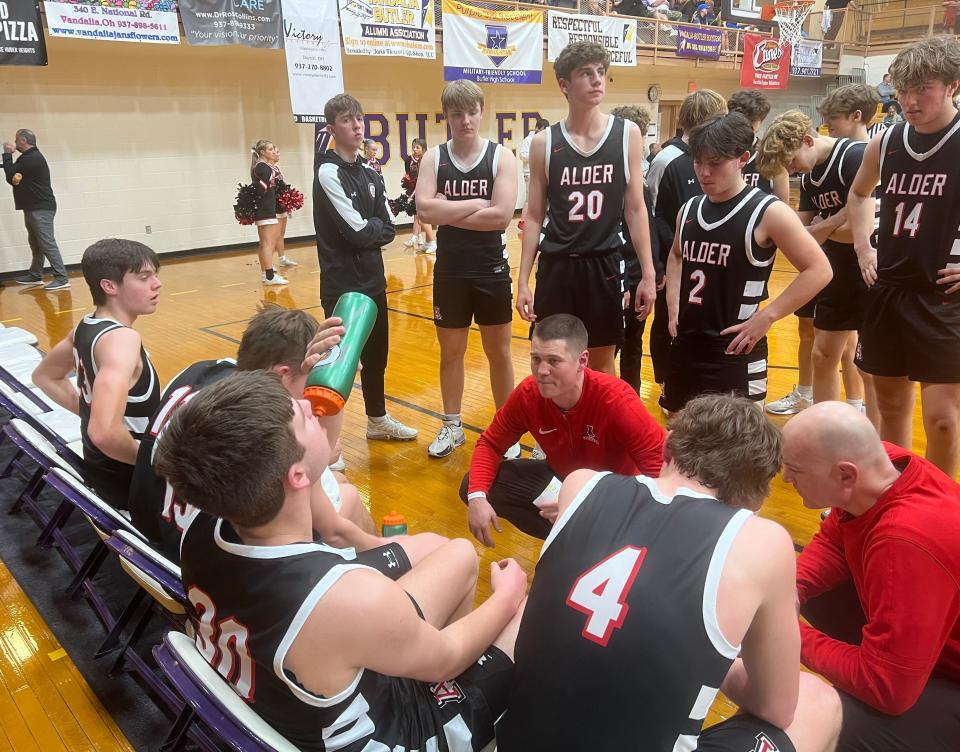 Jonathan Alder coach Derek Dicke talks to his team during its 63-42 loss to Kettering Alter on Thursday in a Division II regional semifinal.