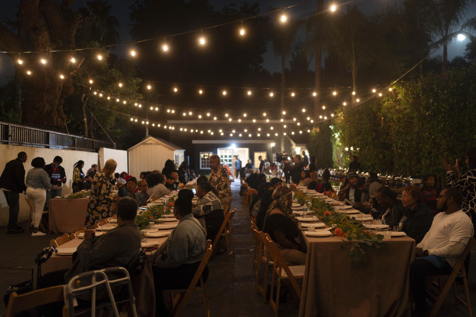 People attend a welcome dinner for the annual Families United 4 Justice Network Conference, hosted by the Black Lives Matter Global Network Foundation at its mansion in the Studio City neighborhood of Los Angeles, Thursday, Sept. 28, 2023. A national Black Lives Matter nonprofit that was widely criticized for purchasing a sprawling California mansion with donated funds recently opened the property to dozens of families who lost loved ones in incidents of police violence. (AP Photo/Jae C. Hong)