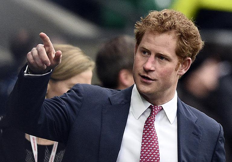 Britain's Prince Harry is pictured ahead of a rugby match at Twickenham Stadium, south west of London, on March 21, 2015