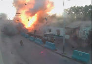 <p>A video grab taken from a Somali police CCTV, date shot May 24, 2017, shows the moment a car explodes near the Mogadishu seaport in Somalia. (Photo: Somali Police/Reuters) </p>