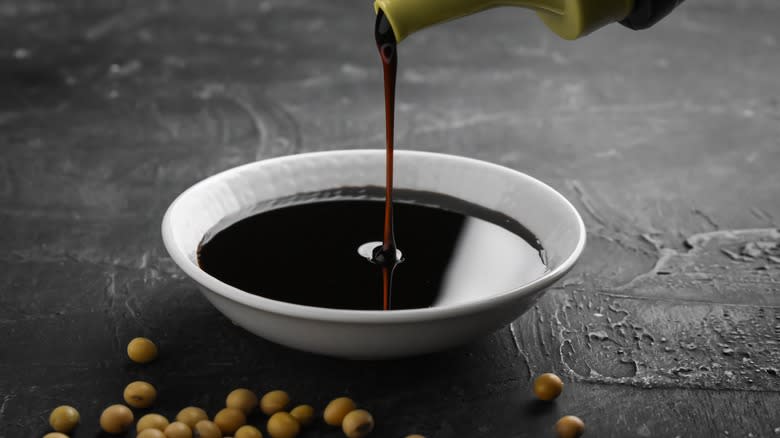 soy sauce pouring from bottle