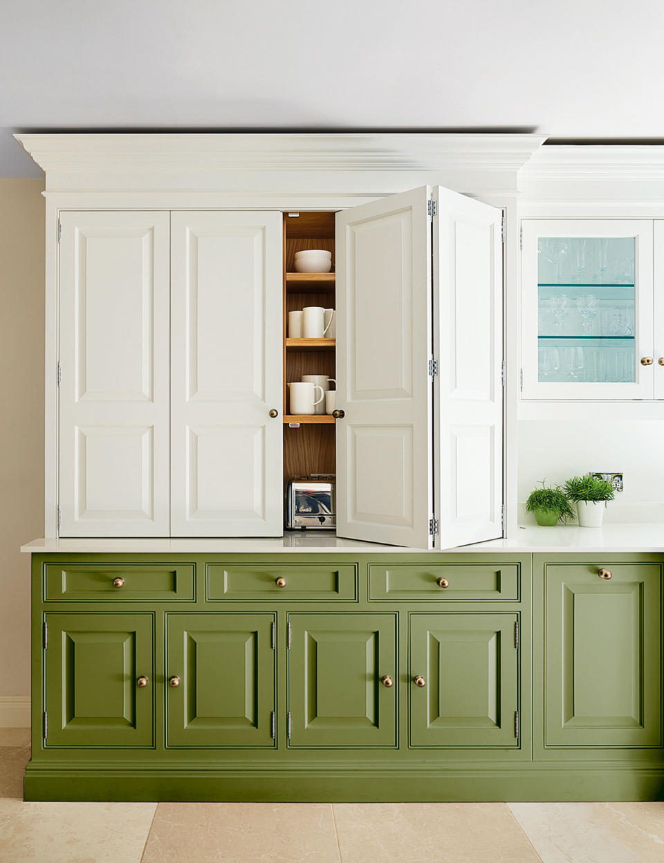 tow-tone kitchen with green and white cabinetry