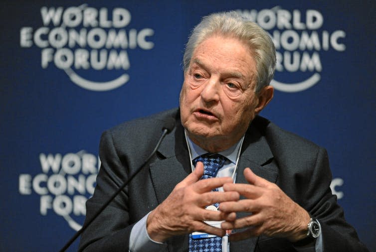 <span class="caption">George Soros is the subject of a harmful conspiracy theory.</span> <span class="attribution"><span class="source">wikipedia</span>, <a class="link " href="http://creativecommons.org/licenses/by-sa/4.0/" rel="nofollow noopener" target="_blank" data-ylk="slk:CC BY-SA;elm:context_link;itc:0;sec:content-canvas">CC BY-SA</a></span>
