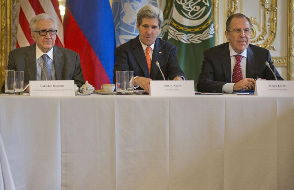 US Secretary of State John Kerry, center, with Russia's Foreign Minister Sergey Lavrov, right, and U.N-Arab League envoy for Syria Lakhdar Brahimi before the start of their meeting at the US Ambassador's residence in Paris, France, Monday, Jan. 13, 2014. Kerry is in Paris for meetings on Syria to rally international support for ending the three-year civil war in Syria. (AP Photo/Pablo Martinez Monsivais, Pool)