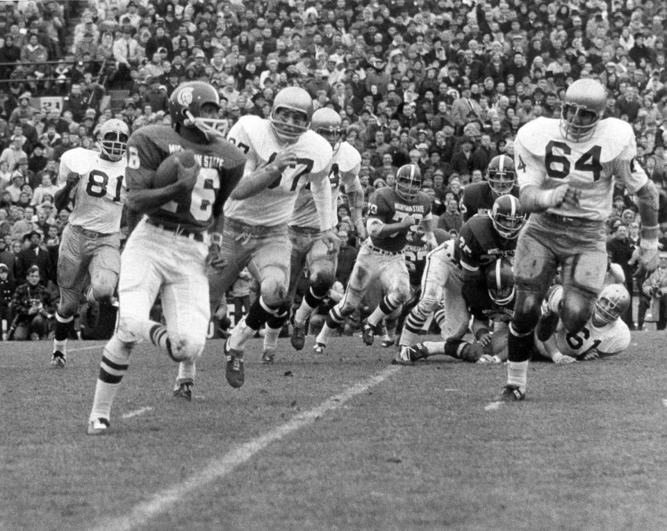 MSU quarterback Jimmy Raye runs around the right side for yardage during the famous 10-10 tie between the Michigan State and Notre Dame on Nov. 20, 1966 in Spartan Stadium.