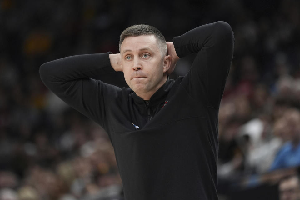 Ohio State interim head coach Jake Diebler watches the first half of an NCAA college basketball game against Iowa in the second round of the Big Ten Conference tournament, Thursday, March 14, 2024, in Minneapolis. (AP Photo/Abbie Parr)